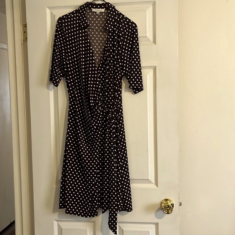 A brown and white polkadot wraparound dress there it is a size medium